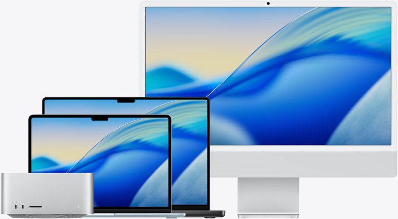 ภาพพื้นหลัง macOS Tahoe บนผลิตภัณฑ์ตระกูล Mac จากซ้ายไปขวา: Mac Studio, MacBook Air รุ่น 13 นิ้ว สีสกายบลู, MacBook Pro รุ่น 14 นิ้ว สีดำสเปซแบล็ค และ iMac รุ่น 24 นิ้ว สีเงิน